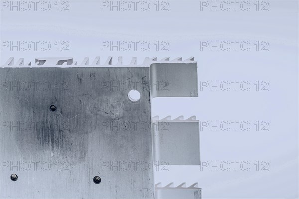 Closeup of mounting surface of rectangle aluminum heat sink on white background