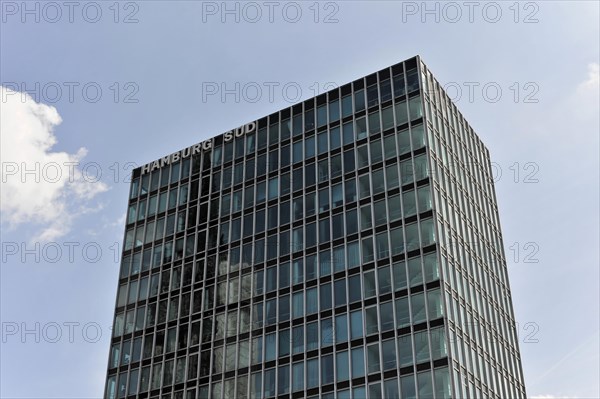 Hamburg Sued Reederei, A modern high-rise building with a reflective glass facade rises into the blue sky, Hamburg, Hanseatic City of Hamburg, Germany, Europe