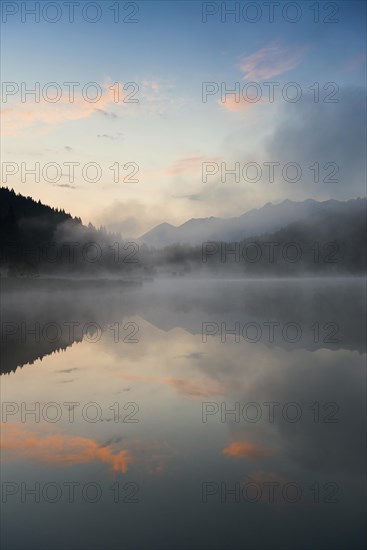 Sunrise and morning fog, Geroldsee or Wagenbruechsee, Kruen near Mittenwald, Werdenfelser Land, Upper Bavaria, Bavaria, Germany, Europe