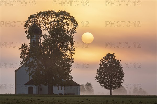 Church at sunrise, fog, sun, backlight, Raisting, Alpine foothills, Bavaria, Germany, Europe