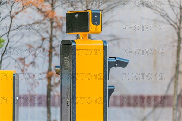 Side view of device to read license plates and calculate charges as cars enter and exit parking garage in Daejeon, South Korea, Asia