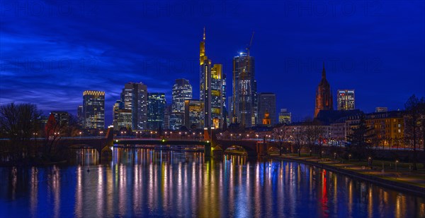 The Frankfurt skyline with office tower blocks behind the Main at blue hour after sunset, on the right the Kaiserdom, Frankfurt am Main, Hesse, Germany, Europe