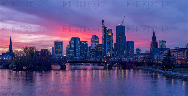 The Frankfurt skyline with office tower blocks behind the Main at sunset, on the left the Dreikoenigskirche, on the right the Kaiserdom, Frankfurt am Main, Hesse, Germany, Europe