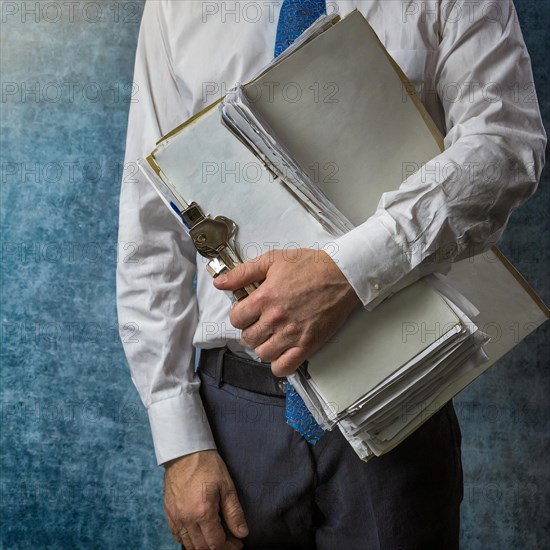 A man in business attire carries a stack of folders and files, symbolism bureaucracy, AI generated, AI generated