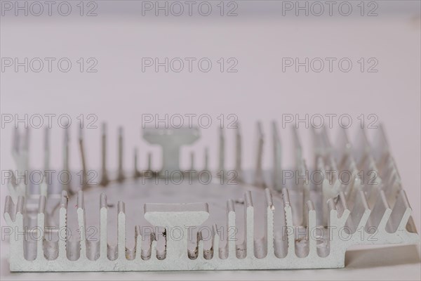 Closeup of fins of rectangle aluminum heat sink on white background