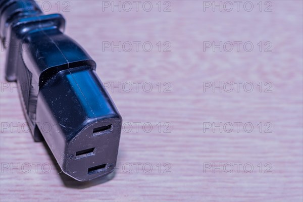 Closeup of computer power cord. This end plugs into device