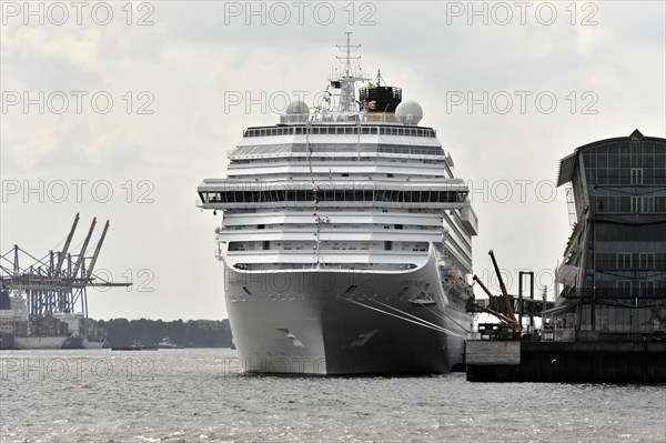 COSTA PACIFICA, Large cruise ship in the harbour with container cranes in the background on a cloudy day, Hamburg, Hanseatic City of Hamburg, Germany, Europe