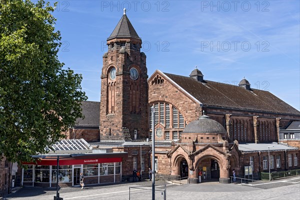 Historic Wilhelmine railway station, clock tower, pavilion with entrance to the station building, neo-Romanesque and Art Nouveau, red sandstone, cultural monument, listed building, Giessen, Giessen, Hesse, Germany, Europe