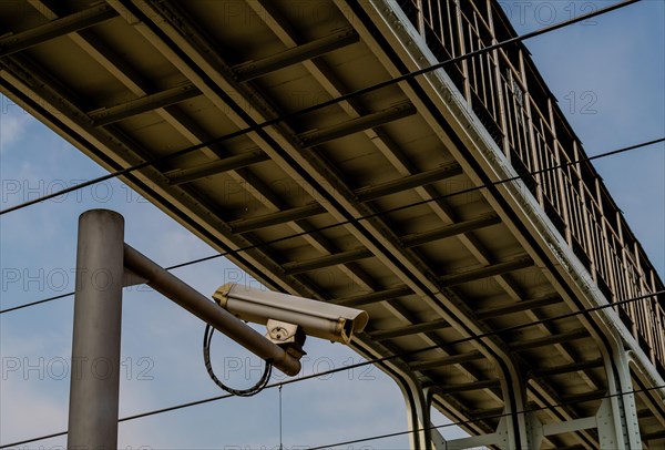 Security camera mounted on a metal pole under a metal bridge in Daejeon, South Korea, Asia