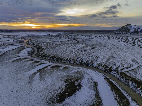 Overgrown river landscape, onset of winter, sunset, volcanic hills, Fjallabak Nature Reserve, drone shot, Sudurland, Iceland, Europe