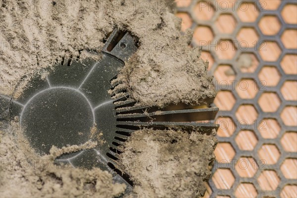 A dusty fan part of an electronic device showing signs of neglect, in South Korea