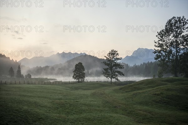 Sunrise and morning fog, Geroldsee or Wagenbruechsee, Kruen near Mittenwald, Werdenfelser Land, Upper Bavaria, Bavaria, Germany, Europe