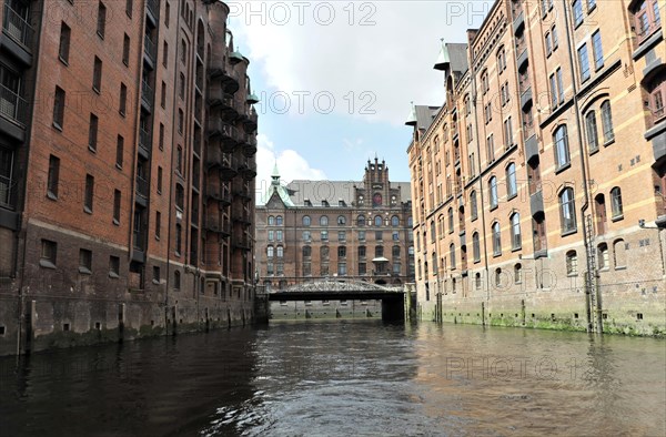 Historic brick buildings on a canal with a bridge in Hamburg's Speicherstadt, Hamburg, Hanseatic City of Hamburg, Germany, Europe