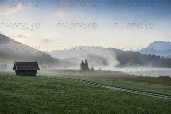 Sunrise and morning fog, Geroldsee or Wagenbruechsee, Kruen near Mittenwald, Werdenfelser Land, Upper Bavaria, Bavaria, Germany, Europe