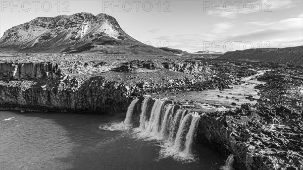 Pjofafoss waterfall, Burfell mountain in the background, drone shot, black and white image, Sudurland, Iceland, Europe