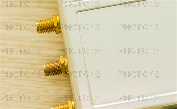 Gold-plated antenna ports on beige technology hardware, in South Korea