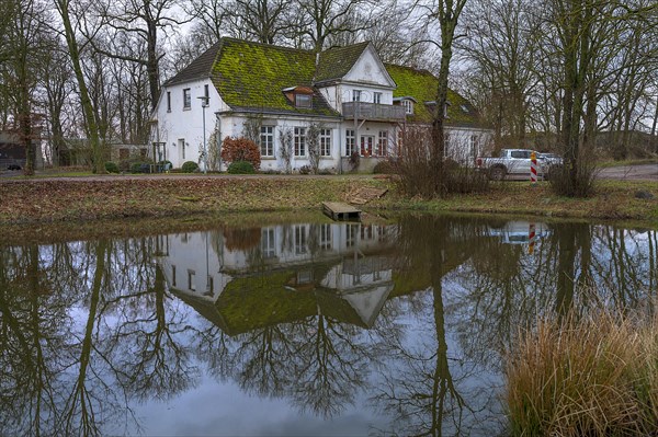 Old manor house reflected in the extinguishing pond, Othenstorf, Mecklenburg-Vorpommern, Germany, Europe