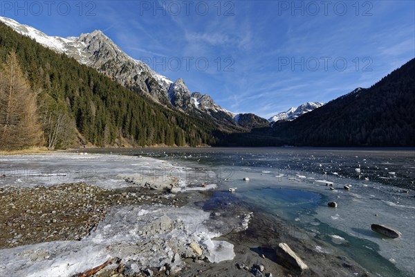 Ice rink in winter on an icy lake, Lake Antholz in the Antholz Valley, Val Pusteria, South Tyrol, Italy, Europe
