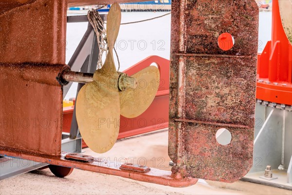 Rusty ship propeller on dry dock, showcasing textures of marine wear and tear, in Ulsan, South Korea, Asia