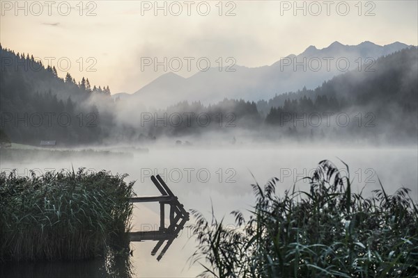 Sunrise and morning fog, Geroldsee or Wagenbruechsee, Kruen near Mittenwald, Werdenfelser Land, Upper Bavaria, Bavaria, Germany, Europe