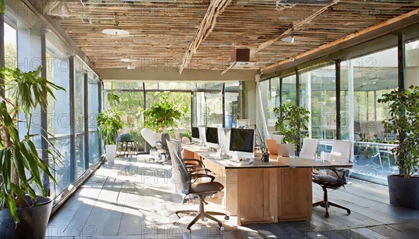 Office with glass facade and warm wooden elements in a naturally sunlit space, Symbol office, AI generated, AI generated