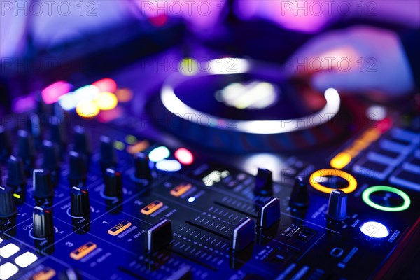 Hand of a DJ on a mixing desk, also called DJ controller or DJ console, at a party, Cologne, North Rhine-Westphalia, Germany, Europe