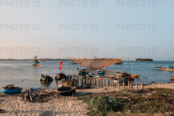 Scenic view of traditional Vietnamese fishing boats in Phan Thiet fishing village in Mui Ne, Vietnam, Asia