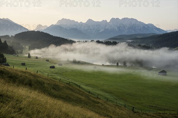 Sunrise and morning fog, Geroldsee or Wagenbruechsee, Kruen near Mittenwald, Werdenfelser Land, Upper Bavaria, Bavaria, Germany, Europe