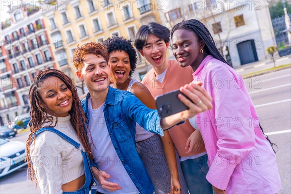 Multiracial young millennial friends taking a selfie standing together in the city
