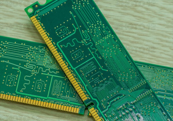 Several RAM modules placed together showcasing their gold contacts and green circuitry, in South Korea