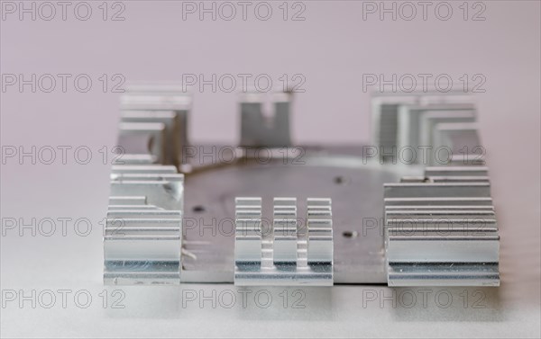 Closeup of fins of rectangle aluminum heat sink on white background