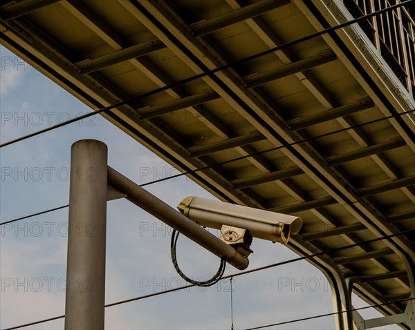 Security camera mounted on a metal pole under a metal bridge in Daejeon, South Korea, Asia