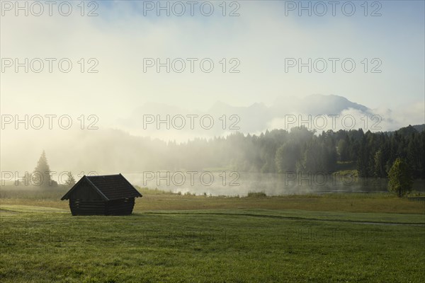 Sunrise and morning fog, Geroldsee or Wagenbruechsee, Kruen near Mittenwald, Werdenfelser Land, Upper Bavaria, Bavaria, Germany, Europe