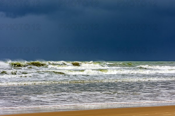Dark rain clouds over the waters of Sargi beach in Serra Grande on the coast of Bahia, Bahia, Brazil, South America