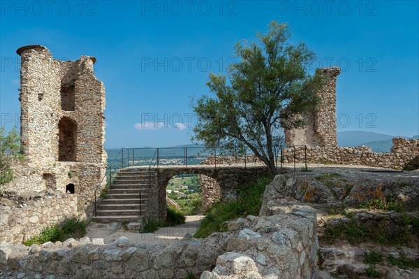 Ruins of Grimaud Castle with a view of the village of Grimaud, in the background the hills of the Massif des Maures, Grimaud-Village, Var, Provence-Alpes-Cote d'Azur, France, Europe