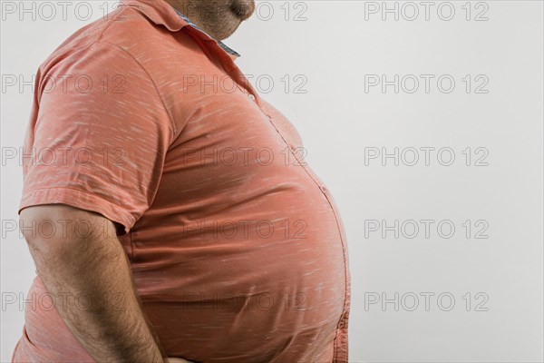 Close up of fat belly of heavily obese man in shirt on white background. KI generiert, generiert, AI generated