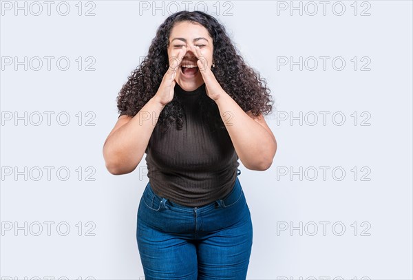 Beautiful girl announcing something to the camera isolated. Young girl screaming and announcing something at you