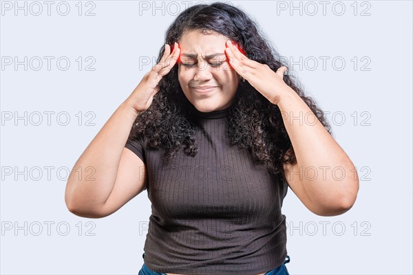 Young woman with headache isolated. Girl suffering from migraine holding head. Headache concept