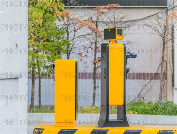 Side view of device to read license plates and calculate charges as cars enter and exit parking garage in Daejeon, South Korea, Asia