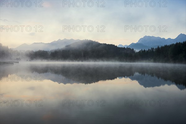 Sunrise and morning fog, Geroldsee or Wagenbruechsee, Kruen near Mittenwald, Werdenfelser Land, Upper Bavaria, Bavaria, Germany, Europe