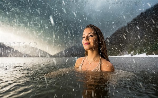 A young pretty woman bathes in an ice-cold lake in snowfall, AI generated, AI generated