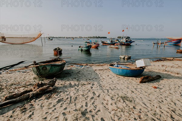 Scenic view of traditional Vietnamese fishing boats in Phan Thiet fishing village in Mui Ne, Vietnam, Asia