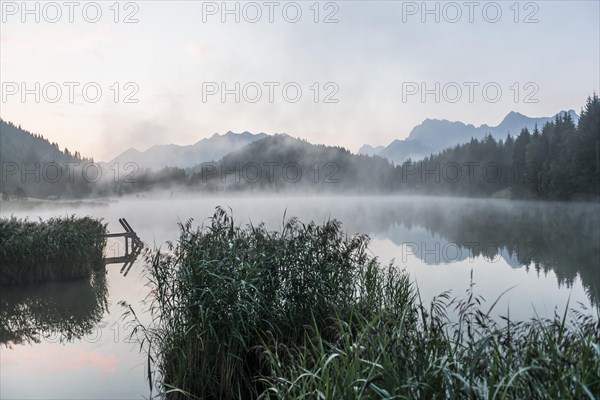 Sunrise and morning fog, Geroldsee or Wagenbruechsee, Kruen near Mittenwald, Werdenfelser Land, Upper Bavaria, Bavaria, Germany, Europe