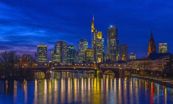 The Frankfurt skyline with office tower blocks behind the Main at blue hour after sunset, on the right the Kaiserdom, Frankfurt am Main, Hesse, Germany, Europe