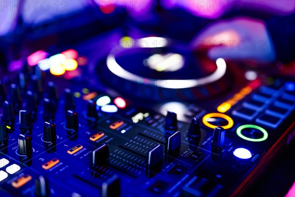 Hand of a DJ on a mixing desk, also called DJ controller or DJ console, at a party, Cologne, North Rhine-Westphalia, Germany, Europe