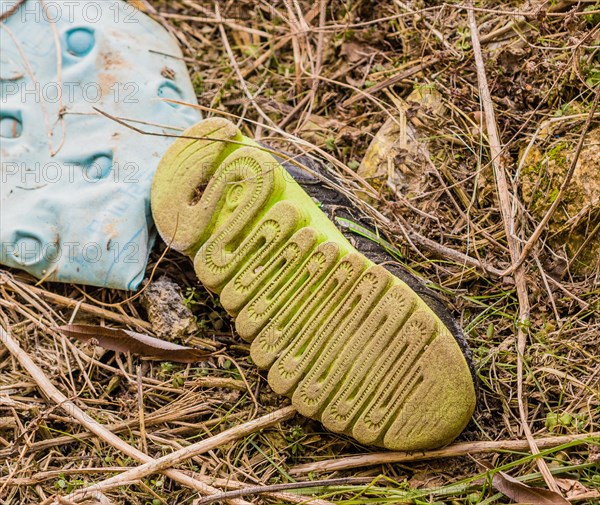 Discarded dirty shoe left in the outdoor environment, in South Korea