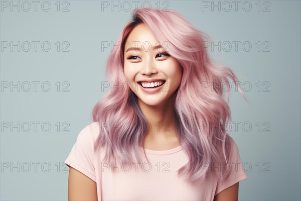 Asian woman with pastel pink and violet hair on blue studio background. KI generiert, generiert, AI generated