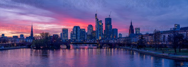 The Frankfurt skyline with office tower blocks behind the Main at sunset, on the left the Dreikoenigskirche, on the right the Kaiserdom, Frankfurt am Main, Hesse, Germany, Europe