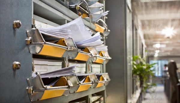 Wall mount with pockets full of documents and folders in an office, symbol bureaucracy, AI generated, AI generated