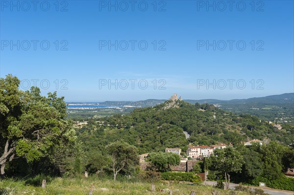 Landscape with the castle of Grimaud, in the background the Gulf of Sant-Tropez and the hills of the Massif des Maures, Grimaud-Village, Var, Provence-Alpes-Cote d'Azur, France, Europe